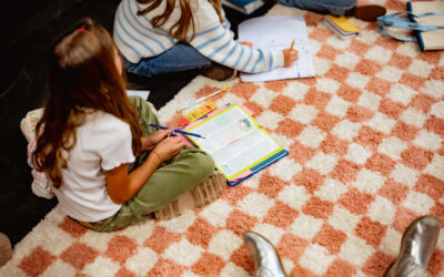 children sitting on the floor with bible